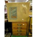 A table top oak chest of 4 drawers with brass handles, and a Will's woodbines cardboard box.