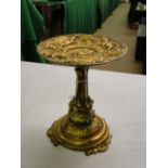 An ormolu tazza with cherub decoration.