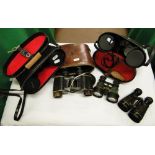 A leather cased pair of First World War military binoculars,