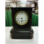 A slate cased mantel clock.