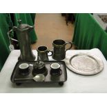 A pewter desk stand, spoon, 19th century pewter mugs with brass rims, engraved coffee pot, etc.