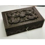 An Indian carved wood box, with dragon decoration, length 11".