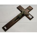 A brass crucifixion figure on rosewood cross.