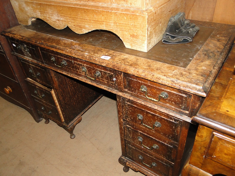 An oak twin pedestal desk