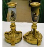 Pair of continental ormolu candlesticks set with painted porcelain stems.