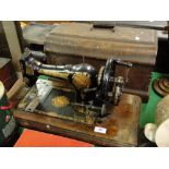Antique Jones sewing machine in walnut case.