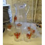Vintage glass water set with eagle decoration.