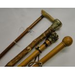 2 Parasols, a walking cane with brass dog's head knop and another, (4).