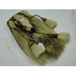 A leather sporran made from a baby badger.