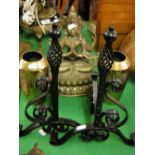 A pair of WMF vases, a brass deity and a pair of and irons.