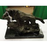 A bronze hound with a game bird, on marble plinth with studio stamp.