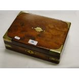 A brass bound mahogany travel box with fitted interior.