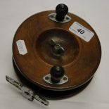 A Vintage mahogany sea fishing reel.