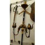 A replica sword and a sword design wall light.