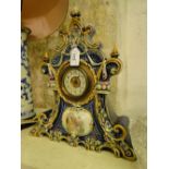 A porcelain cased mantel clock.