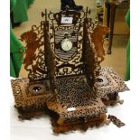 A Black Forest fretwork desk stand with lion figures and a silver cased pocket watch.