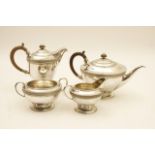 George V silver hammered four piece tea service, by Harold Edwin Landon, Chester 1919,