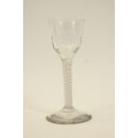 George III wine glass, circa 1770, having an ogee bowl with basal flutes,