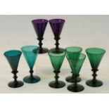 Six Victorian green tinted pedestal wine glasses,