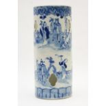 Chinese blue and white cylinder vase, decorated with figures walking within a fenced garden,