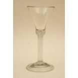 George II wine glass, circa 1740, trumpet bowl with a tear over a solid stem, domed folded foot,