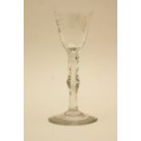 George III wine glass, circa 1790, the round funnel bowl engraved with a rose and bee,