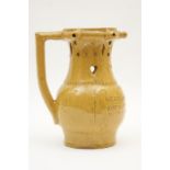 Victorian treacle glazed puzzle jug, circa 1860, traditional form with pierced neck,