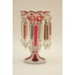 Victorian ruby and white overlay glass lustre, having a single row of drops,