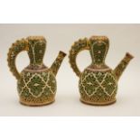 Pair of Zsolnay Pecs reticulated ewers, each pierced in Islamic style and decorated in green,