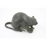 Japanese bronze rat, Meiji (1868-1912), cast holding a water chestnut,