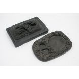 Traditional Chinese ink stone, rectangular form, the cover carved with dragons clutching a pearl,