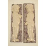 Pair of Anton Lang tin glazed terracotta plaques,