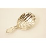George III silver caddy spoon, London 1796, with wrigglework decoration and scalloped bowl,