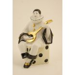 Limoges figural ornament modelled as a Pierrot playing a mandolin, decorated in black,