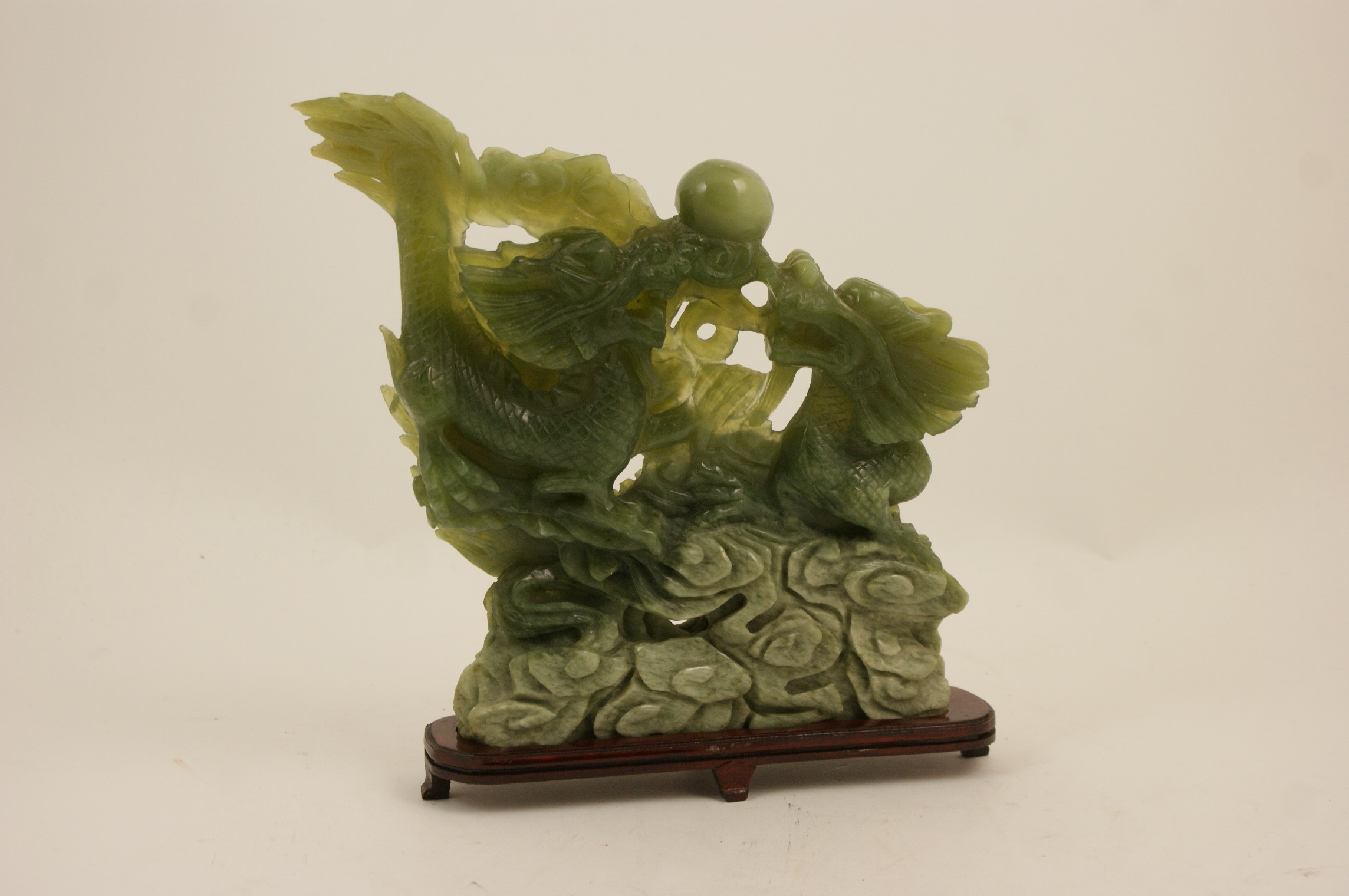 Chinese carved celadon and spinach jade table ornament,