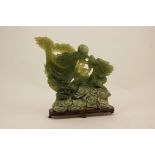 Chinese carved celadon and spinach jade table ornament,