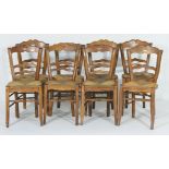 Harlequin set of eight provincial French beech dining chairs, shaped rail backs, string seats,