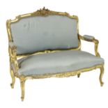 French giltwood canape, with foliate carved and moulded cresting rail,