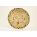 Continental tin glazed sgraffito plate in the Medieval style,