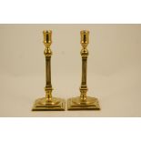 Pair of late George III brass column candlesticks, circa 1790,