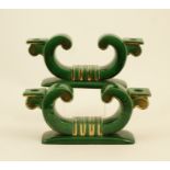 Pair of French Art Deco pottery candlesticks, inverted C-shape,