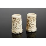 A Pair of Pharmacy Pots,carved ivory, pierced decoration en relief "Oriental figures" Dim. - 10,5