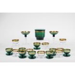 A Set of 16 Short-stemmed Cups,green and colourless crystal, gilt frieze en relief Dim. - 8 x 10 cm