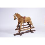 A Rocking Horse, wood, metal and papier-maché, glass eyes, English, 20th C. (1st half), signs of