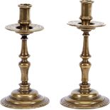 A pair of candlesticks, mannerist, bronze, turned stems, Portuguese, 17th C., signs of use, small