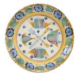 A Dish, faience, polychrome decoration "Cutlery and slices of fish", Portuguese, 19th C., chip and