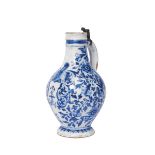 A Jug, faience, blue decoration "Shield charged with symbols and letters topped by helmet and