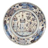 A Dish, faience, blue and vinous «Aranhões» decoration "Landscape with castle", Portuguese, 17th