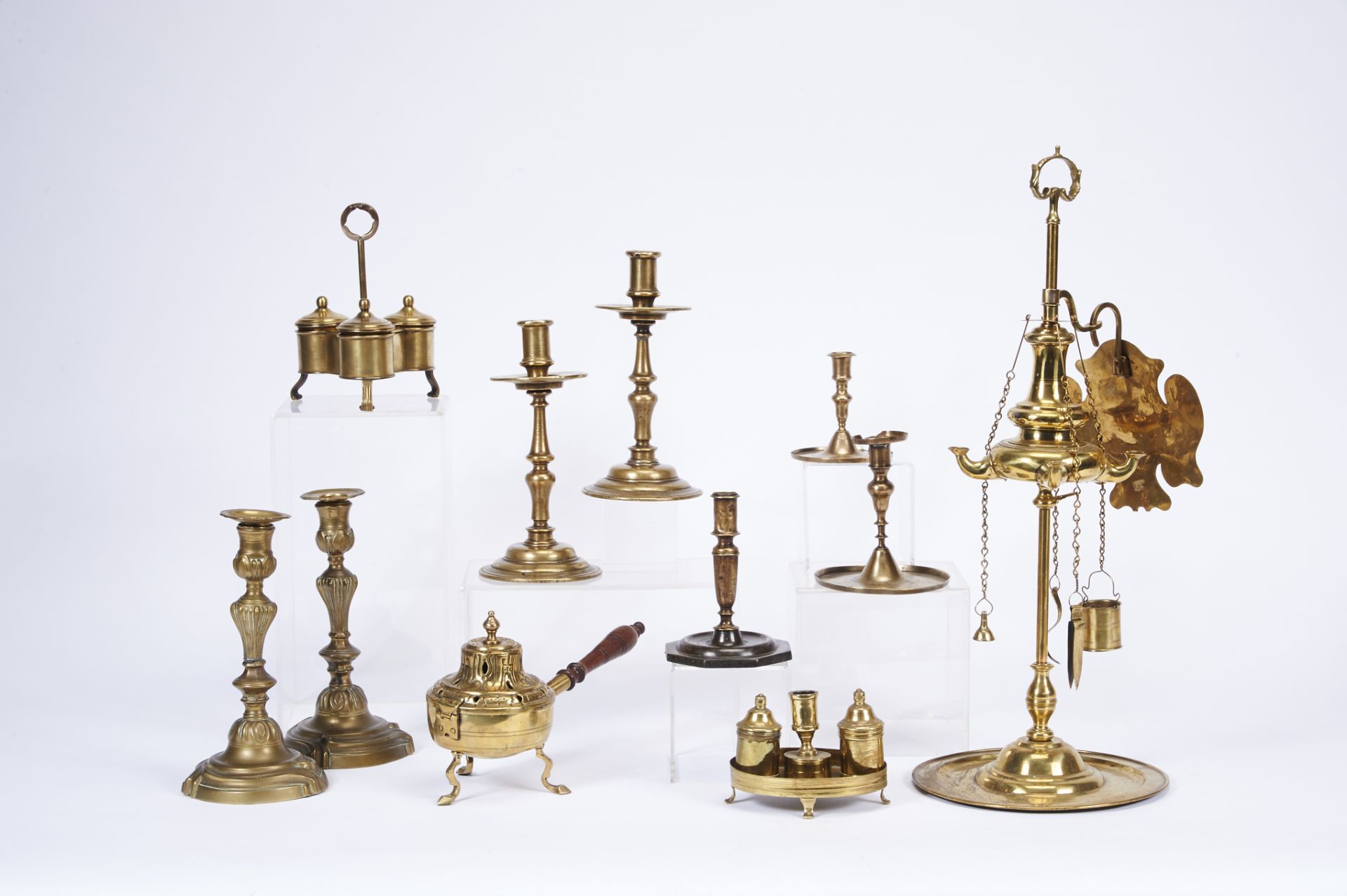 A pair of candlesticks, mannerist, bronze, turned stems, Portuguese, 17th C., signs of use, small