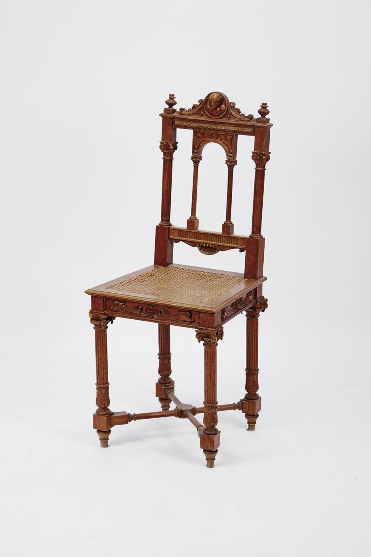 A Chair, romantic, carved oak "Female head", straw seat, Portuguese, 19th C. (2nd half), faults